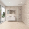 Baño con revestimiento Yosemite Ivory 44x66 (Caja 1.17m2)