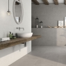 Baño con revestimiento Wave Wall Concrete 25x75