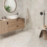 Baño con pavimento Marmi Viena Gold 23x27