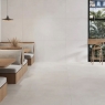 Interior con pavimento y revestimiento Noa White 100x100