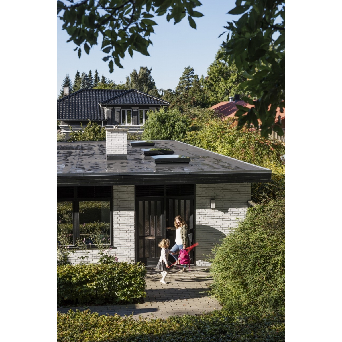 Electric flat roof window with curved glass dome Velux