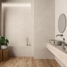 Baño con revestimiento AT Rockstone Relieve Marfil 33,3x55