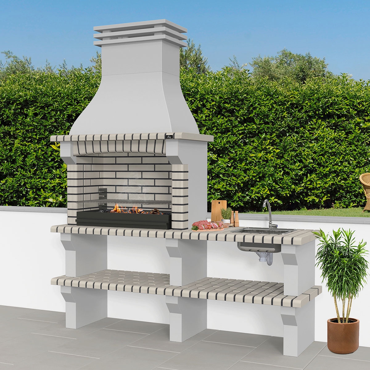 Ambiance avec barbecue avec comptoir, évier et robinet blanc